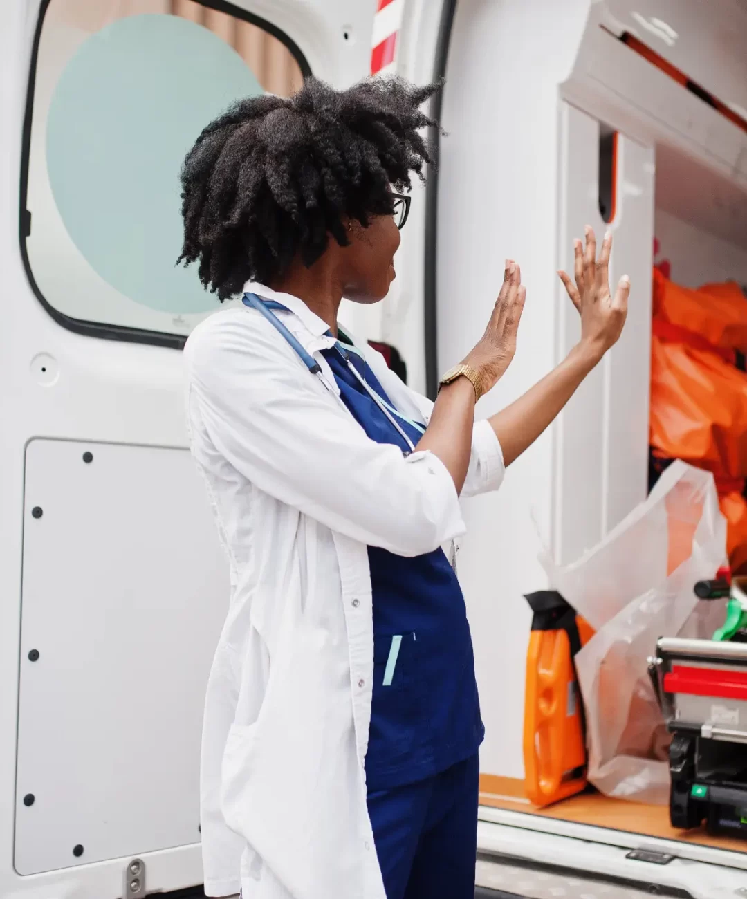 african-american-female-paramedic-standing-front-ambulance-car